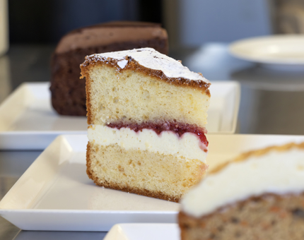 Slices of cake on white plates in the Tearoom. 