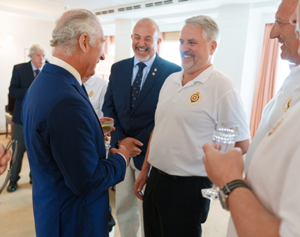 His Majesty The King speaking with laughing Yotties. 