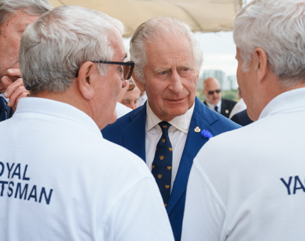 HM The King listening to two former Royal Yachtsmen. 