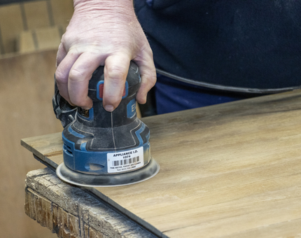 A more detailed picture of Mark sanding. 