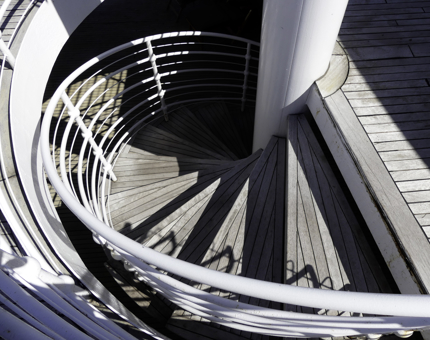 An aerial view of an outside wooden spiral staircase on Fingal. 