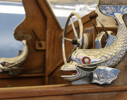 A close up of the silver dolphin fish detail on the Royal Barge