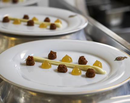 Starter dishes are plated up in the Galley. 