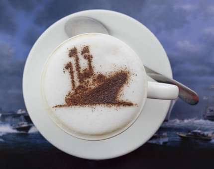 A coffee with a stencil of The Royal Yacht Britannia on it. 