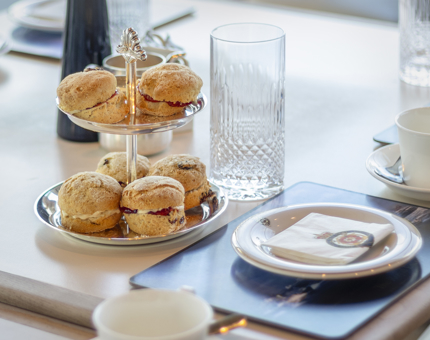A cake stand of miniature scones. 