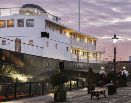 The exterior of Fingal Hotel at sunset. 