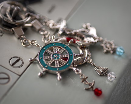 Three nautical inspired keyrings. 