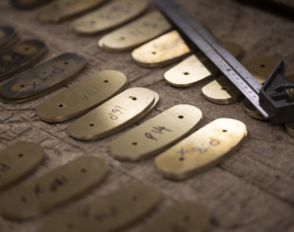 a selection of brass ends to be applied to the end of handrails. 
