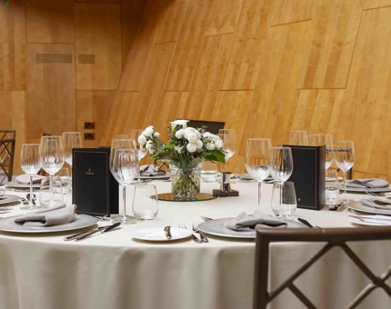 Tables set with cream table cloths in Fingal's Ballroom for an evening event. 