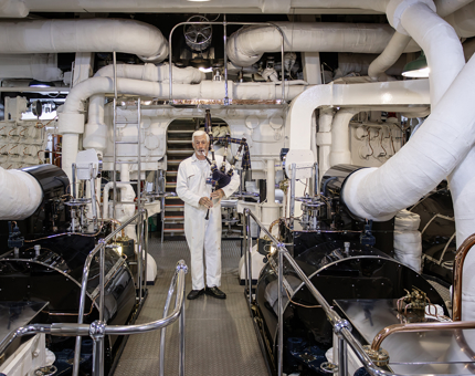 A Leading Marine Engineering Mechanic, piping in the pristine Engine Room
