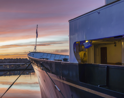 A view of the sunset over the Port of Leith from Britannia's bow. 