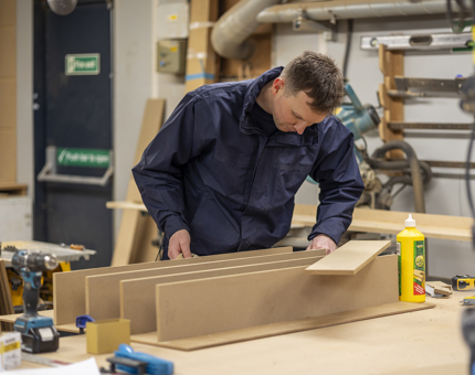Greig continues to assemble to pigeon hole storage.