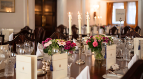 A table setting with candles and flowers A table setting with candles and flowers