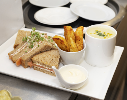 A platter with a sandwich, mug of soup and a bowl of potato wedges is in the Galley aboard Britannia, ready to be served in the Tearoom. 