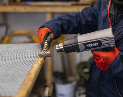 A close up look at the varnish being removed from a wooden step. 