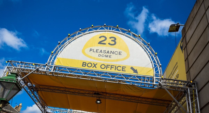 A sign that is a half circle shape for the Pleasance Dome at the Edinburgh Festival Fringe. 