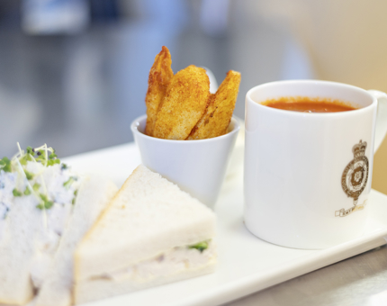 A sandwich, mug of soup and a bowl of wedges ready to be served in Britannia's Tearoom. 