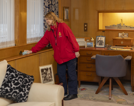 Housekeepr, Lynne, is cleaning Prince Philip's Sitting Room. 