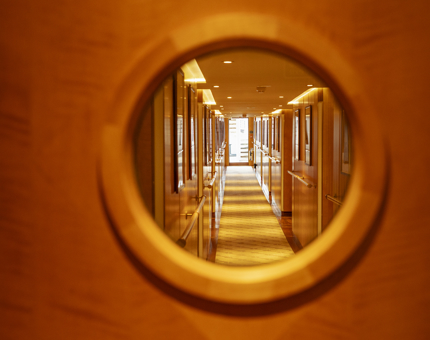 A corridor aboard Fingal looking through a port hole. 