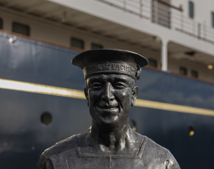 A close up of a statue of The Royal Yacht Britannia's longest serving Royal Yachtsman, Ellis 'Norrie' Norrell MVO RVM.