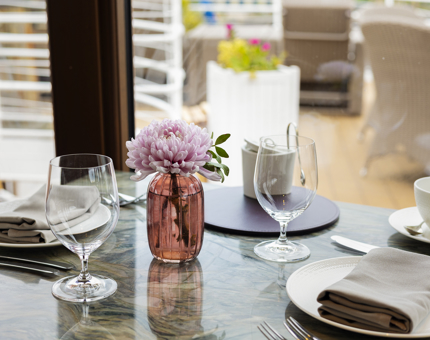 A close up of a table in The Lighthouse Restaurant set for a meal. 