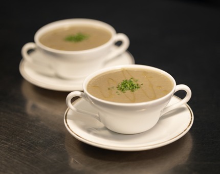Two bowls of mushroom soup. 