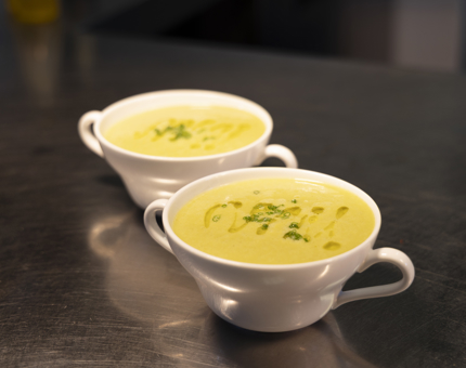Two bowls of soup on the bench in the Galley, it is Cream of Courgette with Cheddar. 