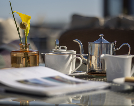 On Fingal's Deck, one of the tables has been set with tea cups and a tea pot. 