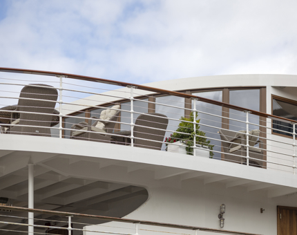 A view of Fingal's Moet Deck in Leith from below. There are deck chairs and plant.