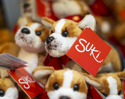 A close up of mini corgi plush toys. 