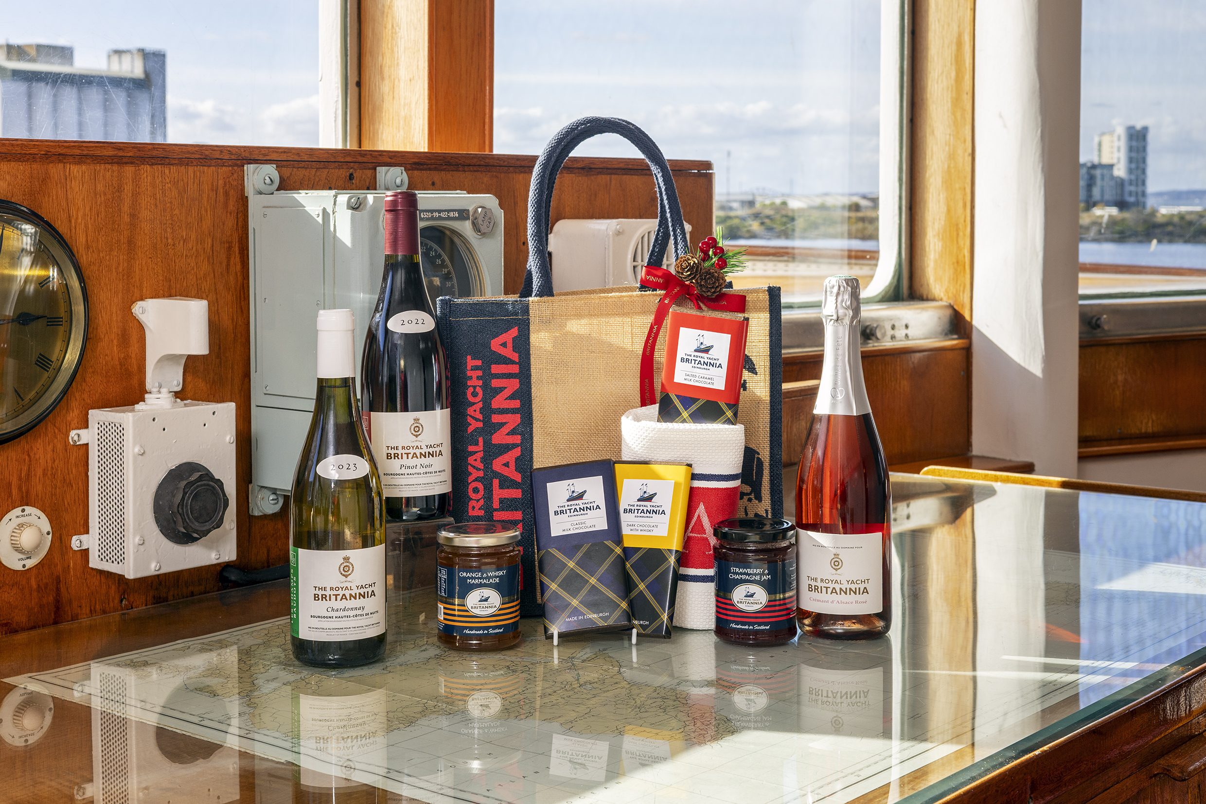 A selection of gifts in front of a hamper 