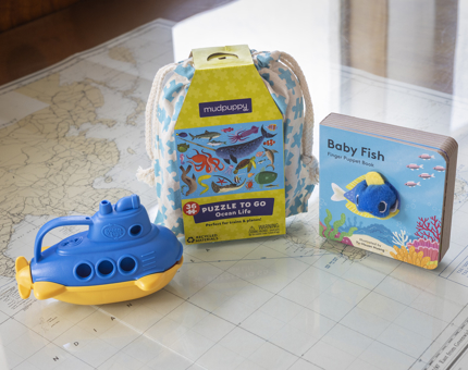 Kids nautical gifts - a yellow and blue submarine toy, ocean life themed puzzle and a book. 