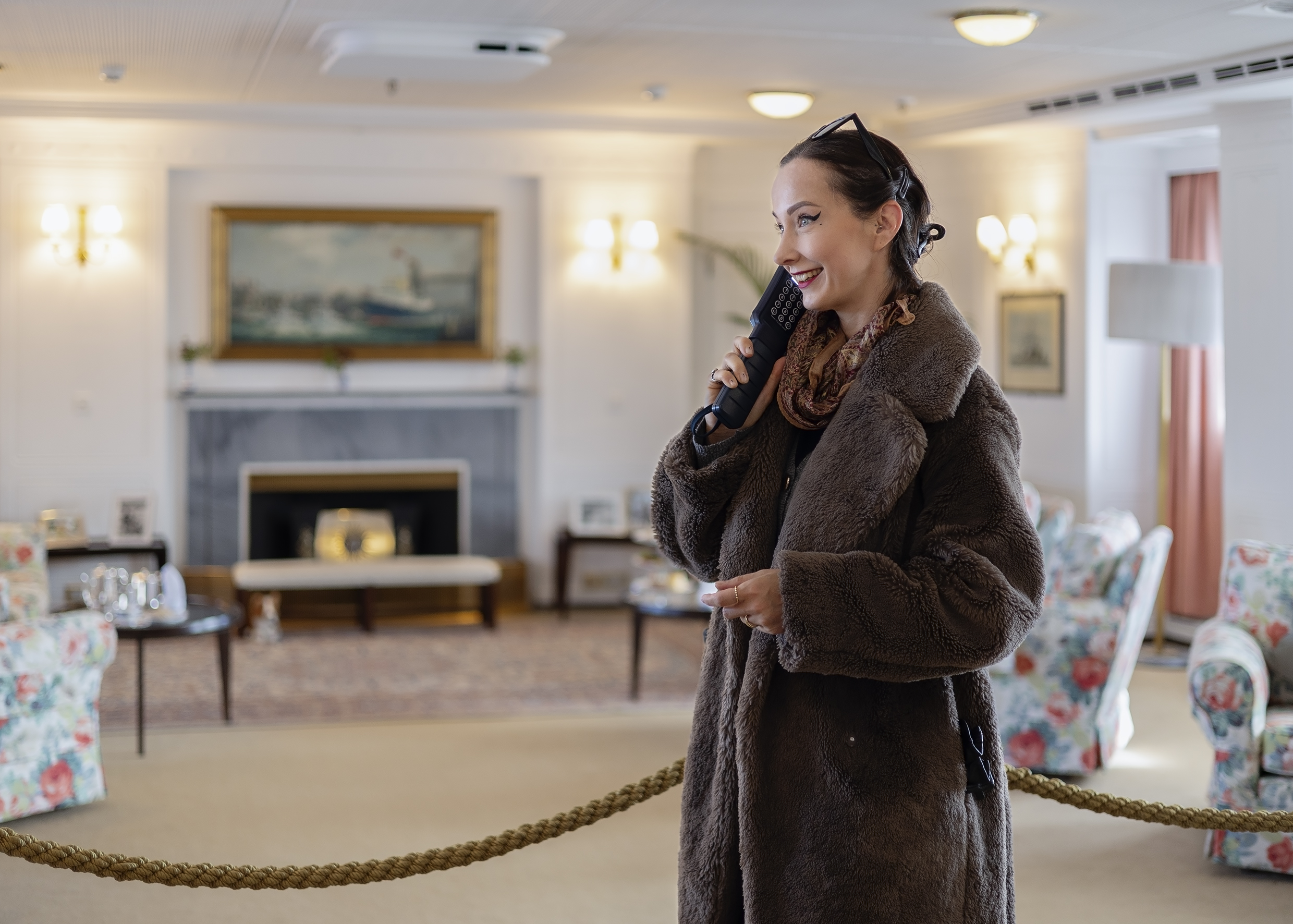 Woman holding a handset on a tour