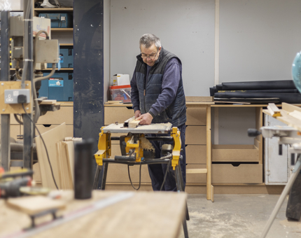 Gary cutting molding for new office storage